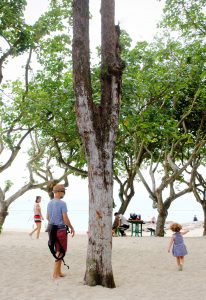 Father and daughter on beach, Lamma Island, Hong Kong