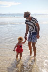 Father and daughter at The Pass, Byron Bay