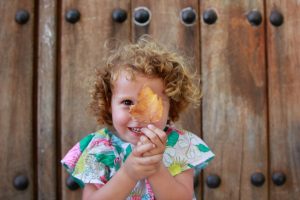 Toddler holding leaf, Gaucin, Spain