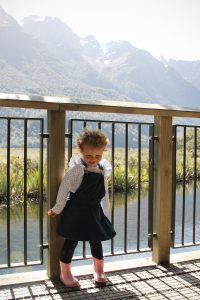 Toddler enjoying the view at Mirror Lake on the way to Milford Sound
